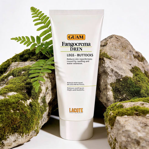 Tube of Guam Fangocrema Dren cream on a natural rock background