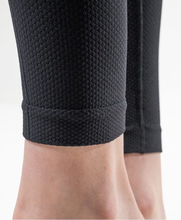 Close-up of GUAM compression leggings at the ankle, where graduated compression for cellulite is firmest