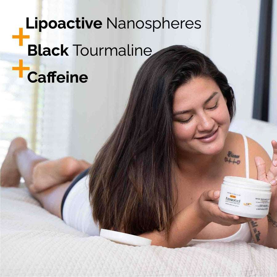 Woman applying a GUAM gel with caffeine and Black Tourmaline to her thighs to smooth cellulite